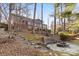 Landscaped backyard with stone fire pit and steps at 60 Sigmon Drum Rd, Hickory, NC 28601