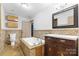 Bathroom with tile flooring, a built-in tub, and double vanity at 60 Sigmon Drum Rd, Hickory, NC 28601