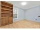 Light-filled bedroom with hardwood floors and built-in shelving at 60 Sigmon Drum Rd, Hickory, NC 28601