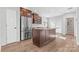 Modern kitchen with island, stainless steel appliances, and hardwood floors at 60 Sigmon Drum Rd, Hickory, NC 28601