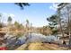 Serene lakefront view with a wooden dock and calm water at 60 Sigmon Drum Rd, Hickory, NC 28601