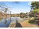 Peaceful lakefront view with calm water and a boathouse at 60 Sigmon Drum Rd, Hickory, NC 28601