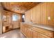 Laundry room with wood cabinets, a sink, and built-in shelving at 60 Sigmon Drum Rd, Hickory, NC 28601