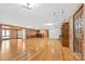 Spacious living room with hardwood floors, a wet bar, and built-in shelving at 60 Sigmon Drum Rd, Hickory, NC 28601
