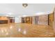 Large living area with hardwood floors, brick walls, and wood built-ins at 60 Sigmon Drum Rd, Hickory, NC 28601