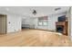 Spacious living room featuring hardwood floors, fireplace, and a charming balcony at 60 Sigmon Drum Rd, Hickory, NC 28601