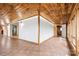 Bright sunroom with wood-paneled walls and ceiling, and tile floors at 60 Sigmon Drum Rd, Hickory, NC 28601