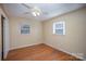 Spacious bedroom featuring hardwood floors and ceiling fan at 632 Armstrong Park Rd, Charlotte, NC 28054