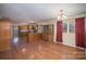 Kitchen and dining area with hardwood floors and wood cabinetry at 632 Armstrong Park Rd, Charlotte, NC 28054