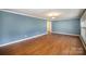 Living room with hardwood floors and blue walls at 632 Armstrong Park Rd, Charlotte, NC 28054