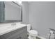 Clean bathroom with gray vanity and updated fixtures at 6613 Montezuma Trl, Charlotte, NC 28227