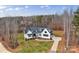 Aerial view of a white farmhouse with a driveway at 7016 Paddle View Ct # 33, Clover, SC 29710