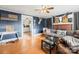 Cozy living room features hardwood floors, fireplace, and a view into the kitchen at 707 Arlington Ave, Albemarle, NC 28001