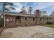 Brick home with large backyard patio and solar panels at 753 Schuyler Dr, Rock Hill, SC 29730