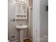 Clean bathroom with pedestal sink, shower, and mirrored medicine cabinet at 753 Schuyler Dr, Rock Hill, SC 29730