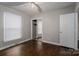 Well-lit bedroom with hardwood floors and mirrored closet doors at 753 Schuyler Dr, Rock Hill, SC 29730
