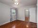 Spacious bedroom with hardwood floors, window, and mirrored closet doors at 753 Schuyler Dr, Rock Hill, SC 29730