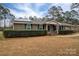 Brick ranch house with green shutters, solar panels, and a landscaped yard at 753 Schuyler Dr, Rock Hill, SC 29730