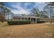 Brick ranch house with green shutters, solar panels, and a landscaped yard at 753 Schuyler Dr, Rock Hill, SC 29730