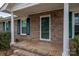 Brick front porch with columns and a green front door at 753 Schuyler Dr, Rock Hill, SC 29730