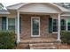 Brick front porch with columns and a green front door at 753 Schuyler Dr, Rock Hill, SC 29730