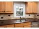 Kitchen boasts double sink, light wood cabinets and granite counters at 753 Schuyler Dr, Rock Hill, SC 29730
