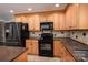 Modern kitchen featuring dark appliances and granite countertops at 753 Schuyler Dr, Rock Hill, SC 29730