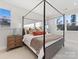 Bright bedroom featuring a canopy bed and plenty of natural light at 8005 Elevate Ct, Charlotte, NC 28205