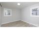 Spacious bedroom with neutral walls and wood-look floors at 100 Valley Rd, York, SC 29745