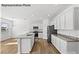 Modern kitchen with white cabinets, granite counters, and island at 10003 Travis Floyd Ln # 050, Charlotte, NC 28214