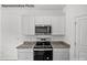 Well-equipped kitchen with granite countertops and stainless steel appliances at 10003 Travis Floyd Ln # 050, Charlotte, NC 28214