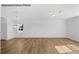 Bright and airy living room with hardwood floors at 10003 Travis Floyd Ln # 050, Charlotte, NC 28214