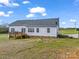 Rear view of home showcasing deck and large yard at 1018 Padgett Rd, Shelby, NC 28150