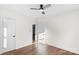 Bedroom with wood floors, ceiling fan and access to another room at 1102 York Rd, Kings Mountain, NC 28086