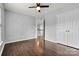 Bedroom with wood floor, ceiling fan and access to upper loft at 116 Diamond Head Dr, Mooresville, NC 28117