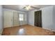 Simple bedroom with light blue walls and hardwood floors at 122 Baldwin Ave, Kannapolis, NC 28083