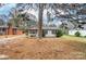 House exterior showcasing a large tree and yard at 122 Baldwin Ave, Kannapolis, NC 28083