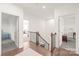 Upstairs hallway with access to bedrooms and a home gym at 128 Shimmer Lake Ln, Belmont, NC 28012