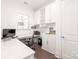 Bright home office with built-in white cabinets and workspace at 128 Shimmer Lake Ln, Belmont, NC 28012