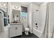 Bathroom with white vanity, hex tile floor, and shower/tub combo at 13251 Chopin Ridge Rd, Huntersville, NC 28078