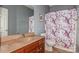 Bathroom with shower/tub combo and floral shower curtain at 16718 Dolcetto Way, Charlotte, NC 28277