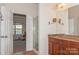 Main bathroom with shower, double vanity, and access to bedroom at 16718 Dolcetto Way, Charlotte, NC 28277
