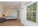 Cozy bedroom with ample natural light and a view of the yard at 16718 Dolcetto Way, Charlotte, NC 28277