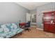 Bedroom with a sofa, desk, and built-in shelving at 16718 Dolcetto Way, Charlotte, NC 28277