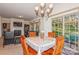Small dining area with wood table and chairs, view to backyard at 16718 Dolcetto Way, Charlotte, NC 28277