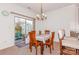 Charming dining area with a wooden table and access to a patio at 16718 Dolcetto Way, Charlotte, NC 28277