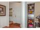 Inviting entryway with hardwood floors and built-in shelving at 16718 Dolcetto Way, Charlotte, NC 28277