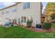 Rear exterior showing the patio and landscaping at 16718 Dolcetto Way, Charlotte, NC 28277