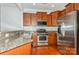Modern kitchen featuring stainless steel appliances and granite countertops at 16718 Dolcetto Way, Charlotte, NC 28277