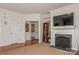 Living room features hardwood floors, fireplace, and access to other rooms at 16718 Dolcetto Way, Charlotte, NC 28277